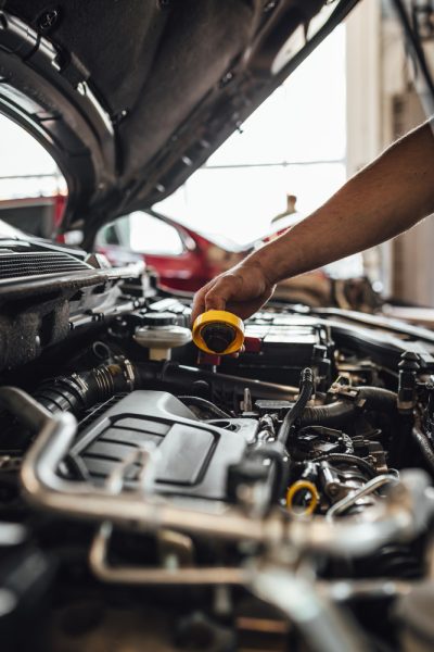 closeup-shot-auto-mechanic-hands-doing-car-technical-inspection-service